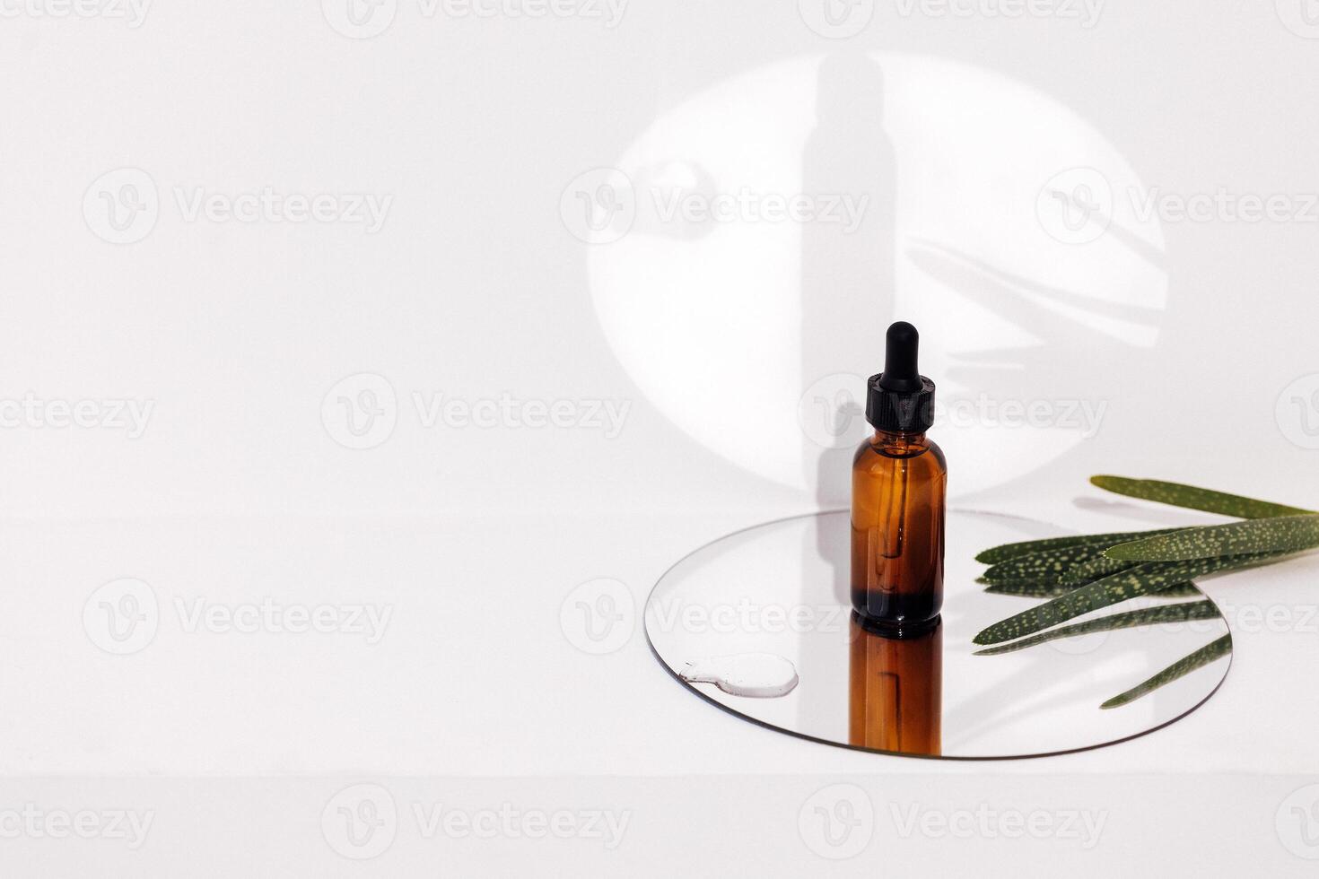 Group of brown bottle and their reflection on a mirror surface photo