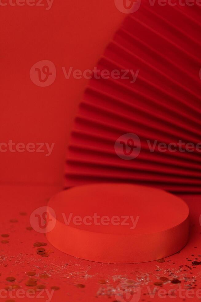 Empty holiday template for design with red round stage. Bright background with sparkles and confetti. photo