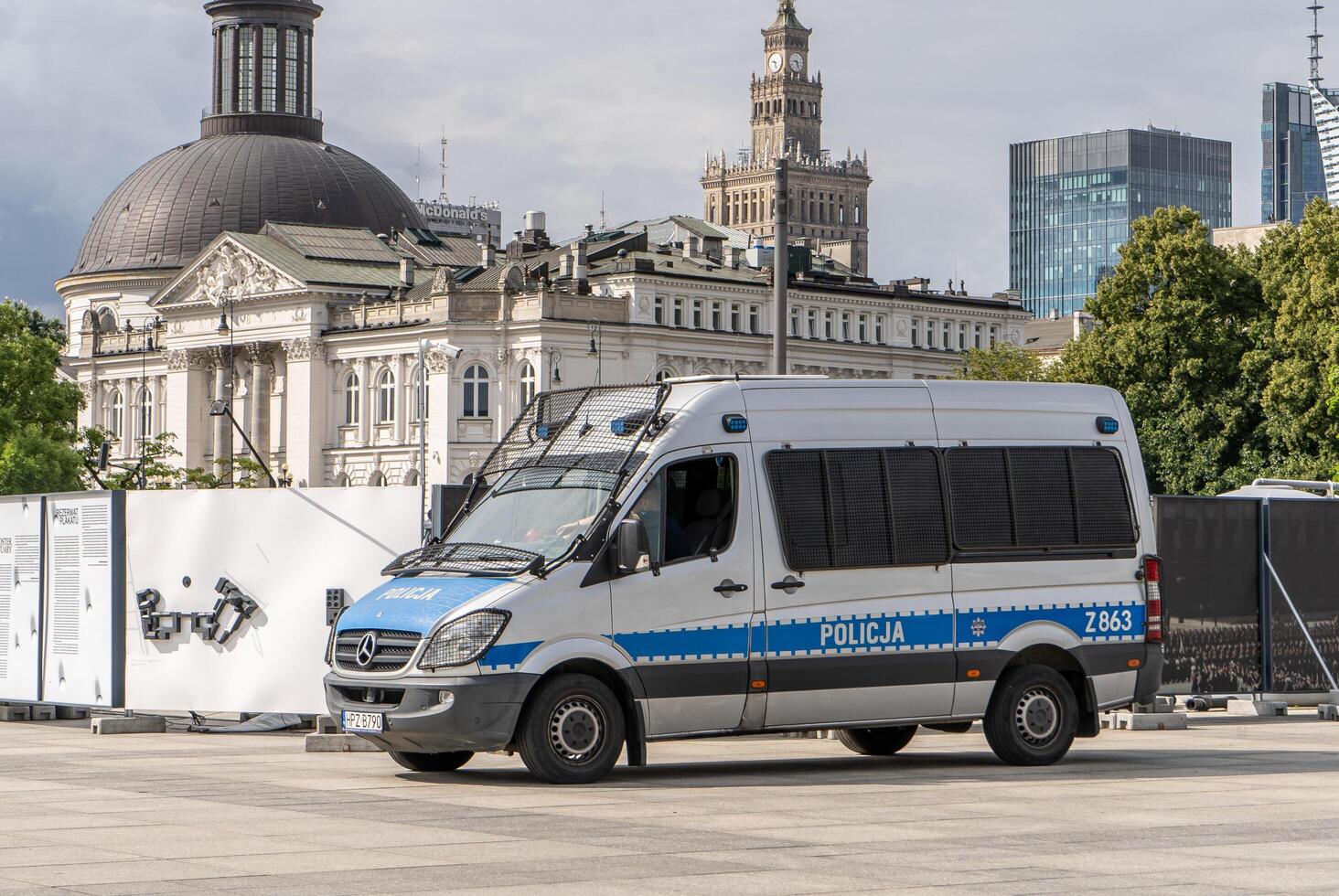 Police car on the street. Polish police patrol and order. City of Warsaw, Poland - July 26, 2023 photo