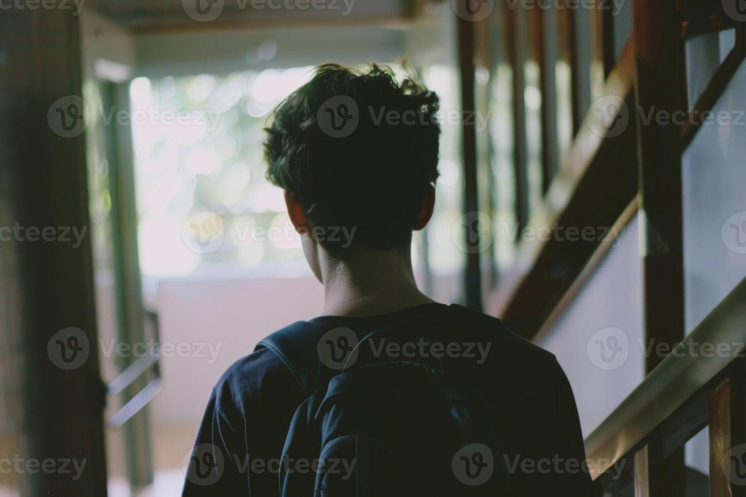 Young person standing in front of door decision making deciding entering light welcome guest concept real estate career path choosing study choice possibility opportunities mortgage photo