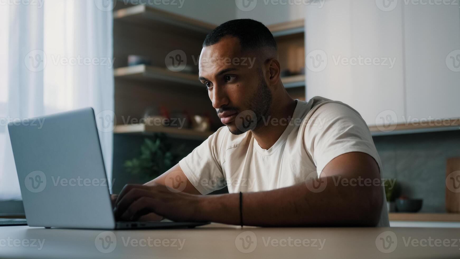 Mad sad unhappy panic male looser African millennial man guy American user freelancer worker gamer at home kitchen work with laptop lost failure problem with computer app online mistake error crash photo