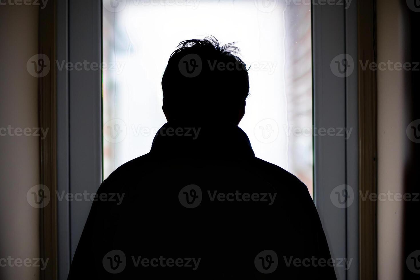 Young person standing in front of door decision making deciding entering light welcome guest concept real estate career path choosing study choice possibility opportunities mortgage photo