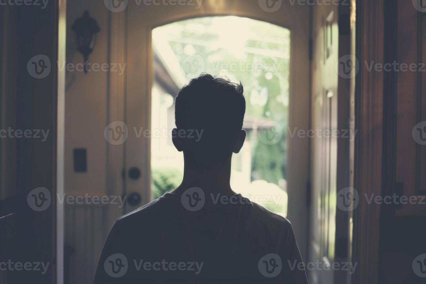 Young person standing in front of door decision making deciding entering light welcome guest concept real estate career path choosing study choice possibility opportunities mortgage photo