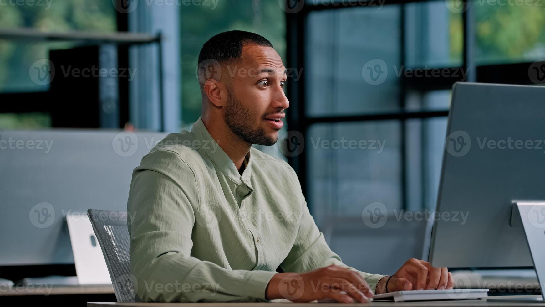 African American businessman employer entrepreneur manager CEO typing keyboard computer in office work with net online project has good result happy triumph win victory winning celebrate offer achieve photo