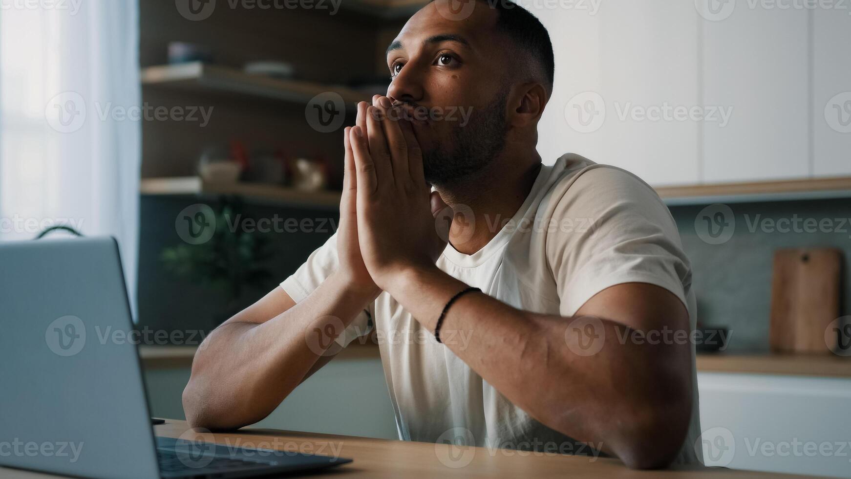 African Latina male man at kitchen at home play online game bet losing betting bad result feel frustrated upset working problems business failure with laptop cryptocurrency crash mistake with computer photo