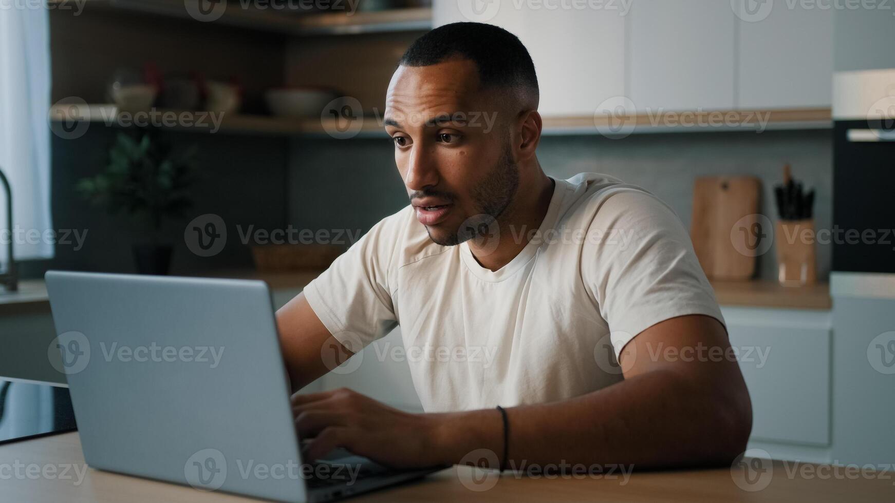 African sad upset worried man American dissatisfied guy male worry about online problem slow connection low computer battery failure lose with laptop loosing in game crash broken website mistake error photo