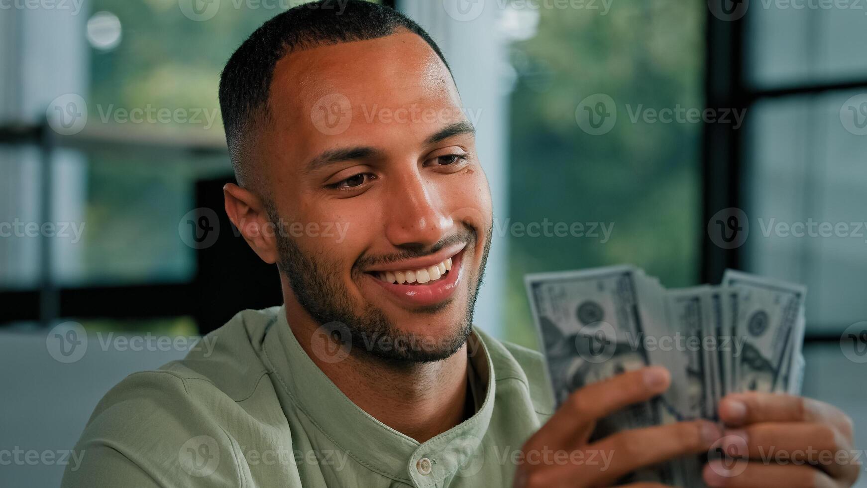 Male portrait happy smiling rich success Latin man counting money African American businessman holding fan of dollars banknotes cash financial winning prize enjoy exchange savings salary finance bribe photo