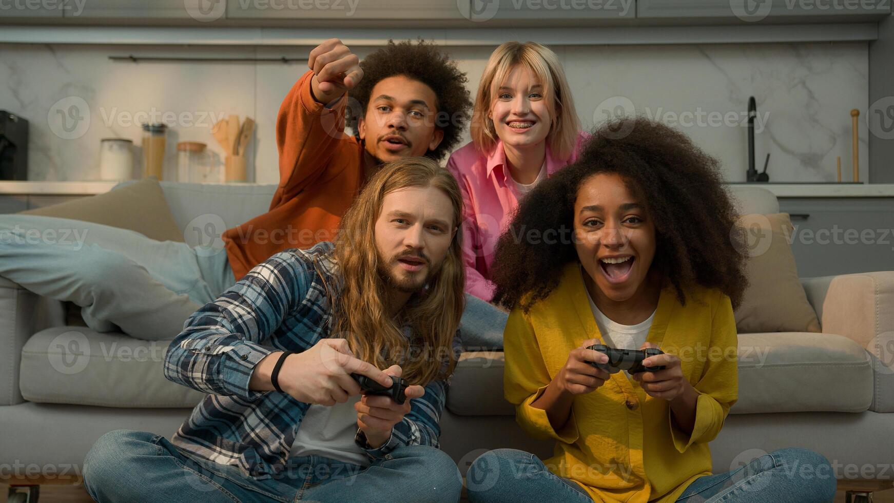 Multiracial diversity friends playing console together fun laughing Caucasian women men support game African American woman win man lost loose failure guys girls females males friendship at home photo