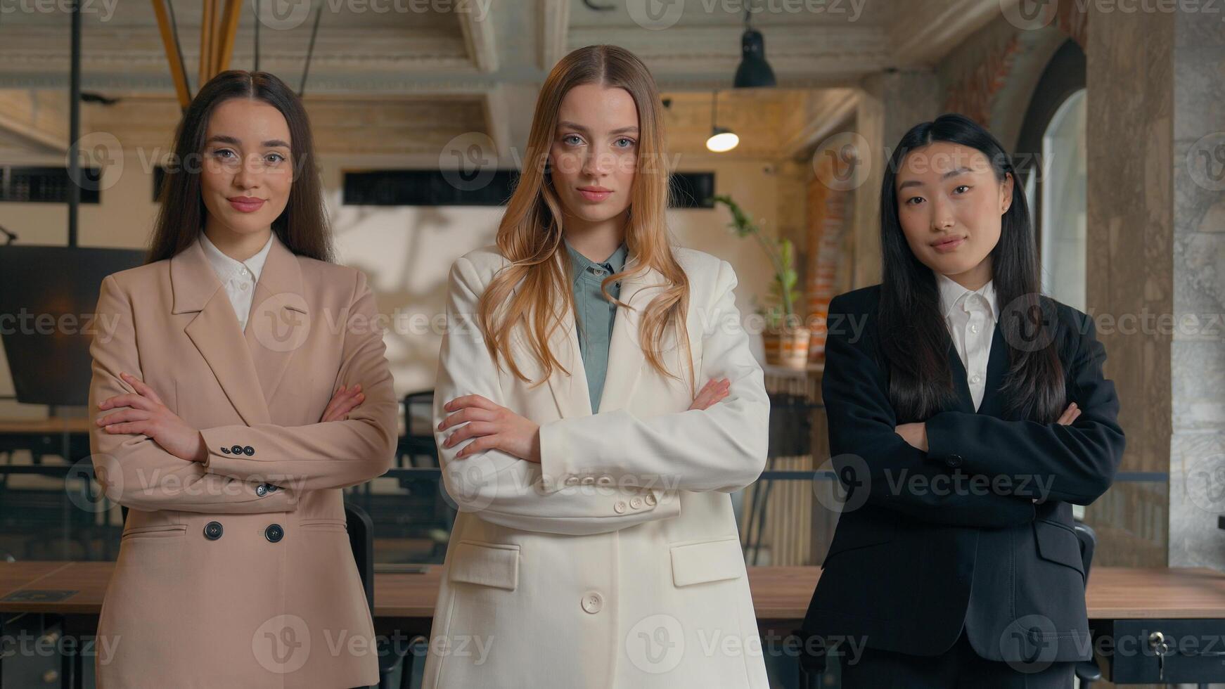 Feminity power confident serious professional business team women people colleagues females multiracial multiethnic girls businesswomen diversity Caucasian Asian Korean manager in office hands crossed photo