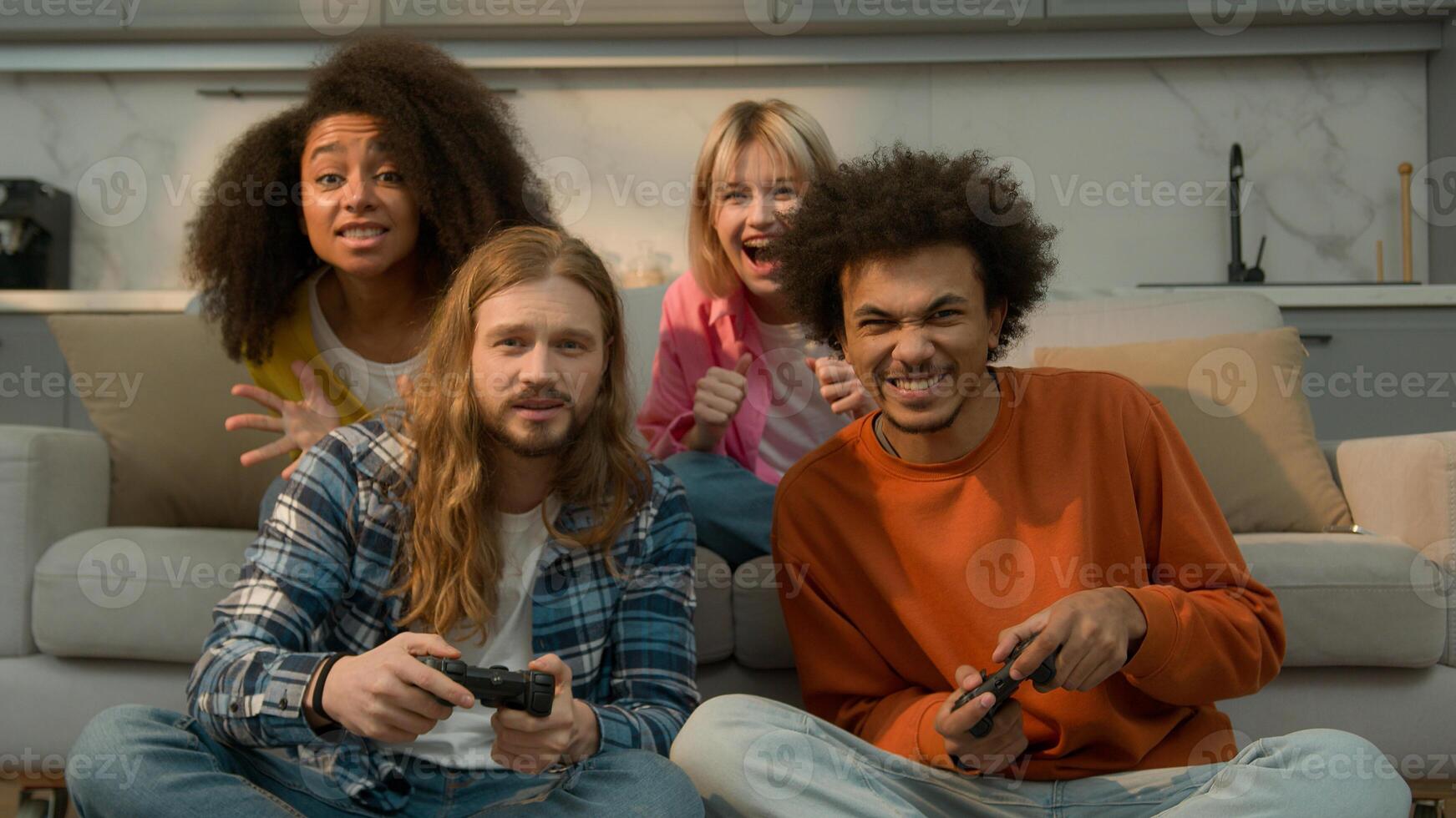 Multiracial diversity people friends together fun joy entertainment laugh Caucasian women support men playing console game playing gaming addict African American guys girls females males at home photo