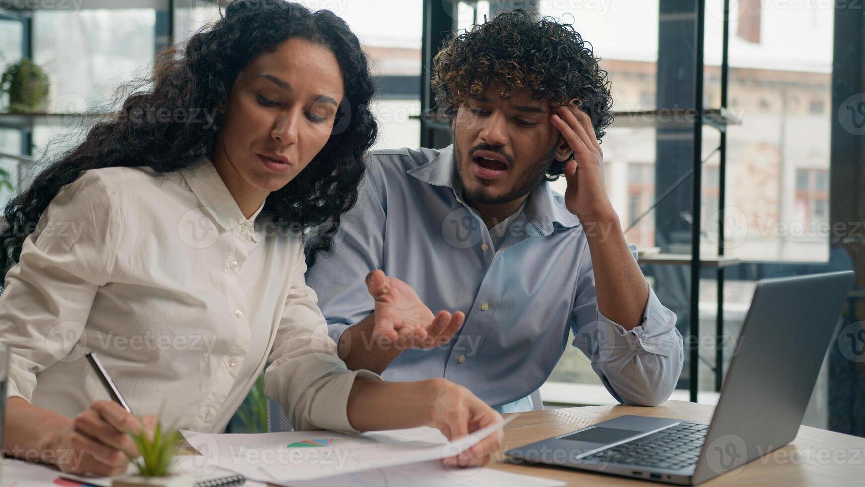 Professional mentor Arabian businesswoman help teach Indian worker analysis explain web project laptop difficult business quarrel conflict misunderstanding teamwork woman man use computer at office photo