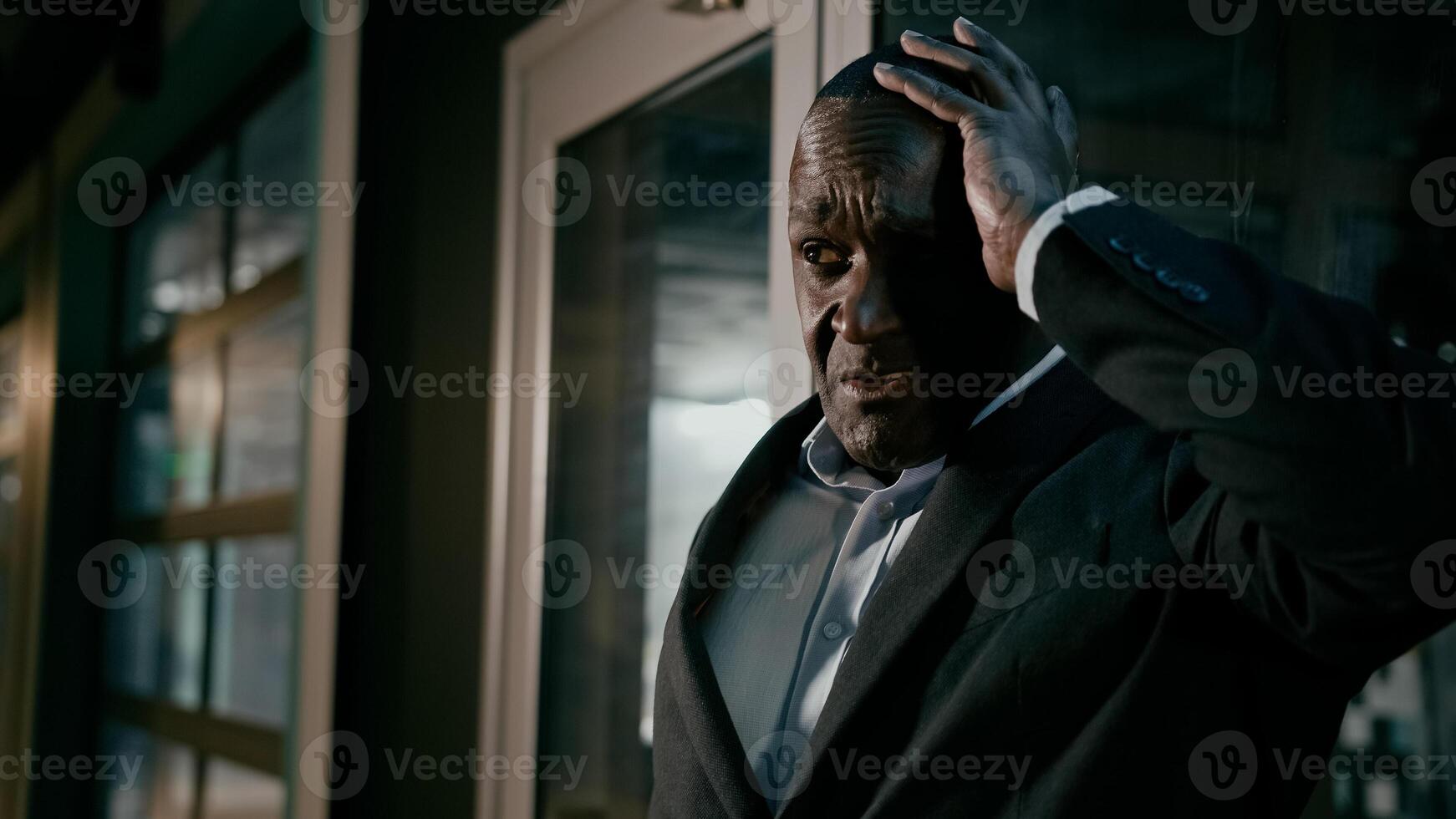 Unhealthy sick mature african american man feel headache holding head suffering from chill talking about feeling unwell frustrated ill adult businessman suffer from chronic migraine seasonal flu pain photo