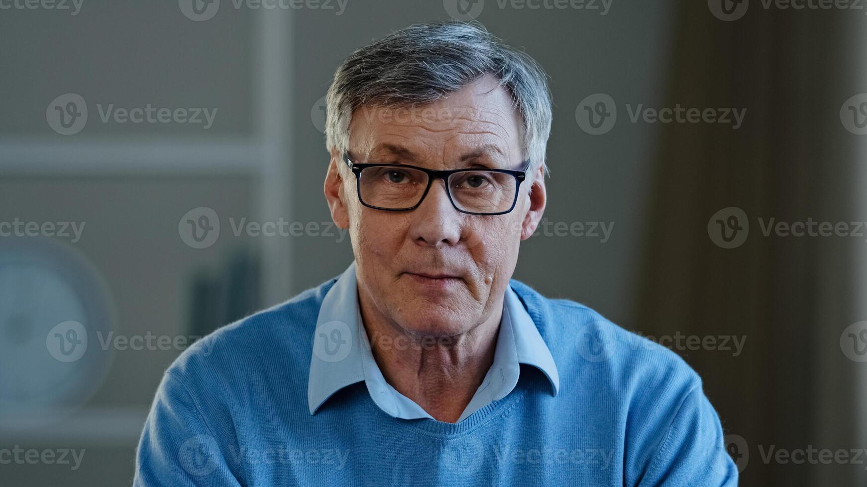Webcam view old businessman serious conversation talk, distant meeting disagree reject reaction mature man looking at camera talking online senior old 60s male teacher in glasses class lesson photo