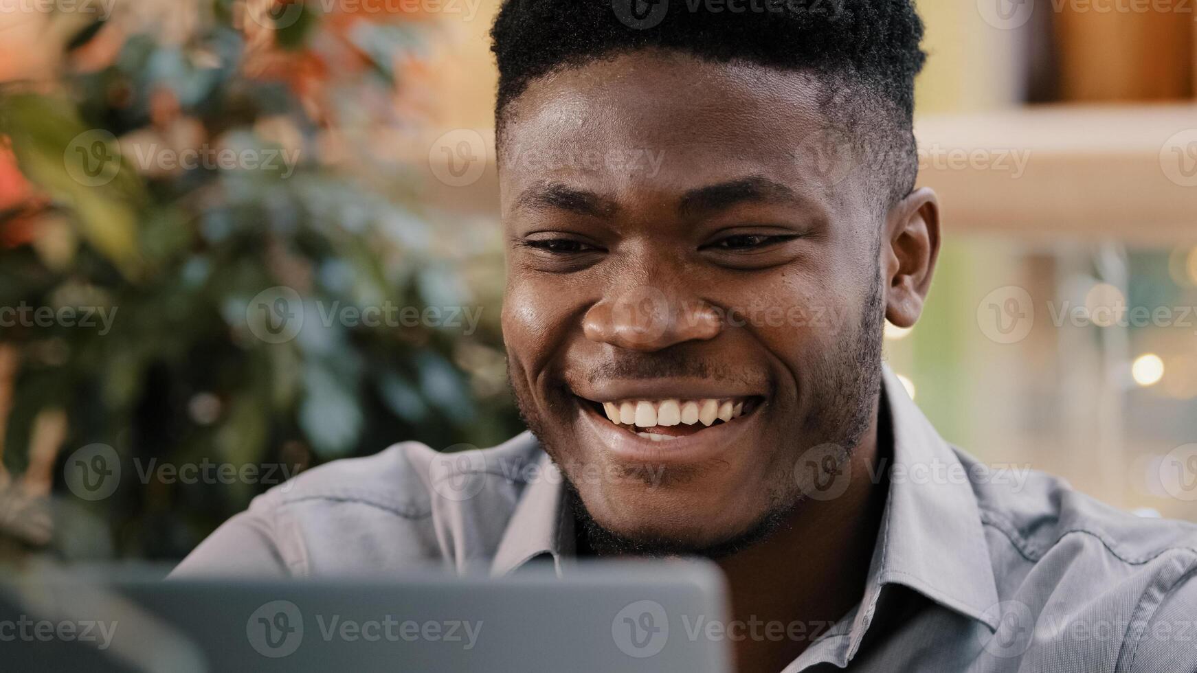 Close-up serious pensive male student freelancer thinks over project young puzzled businessman searching solution problem deep in thought remembers finds idea smiling enthusiastic typing on laptop photo