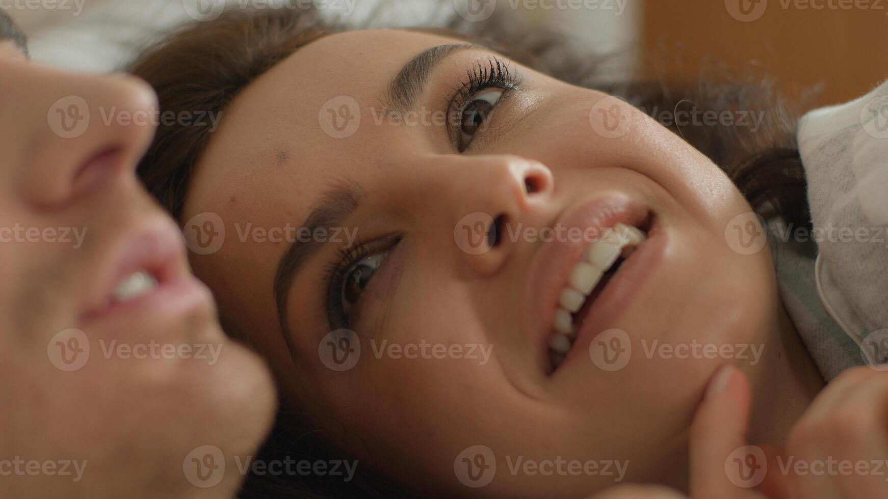 Close up happy faces man woman couple love cuddle family girlfriend boyfriend husband wife lying bed expression togetherness talk chat beloved intimacy partner tenant embrace smile sweetheart feeling photo