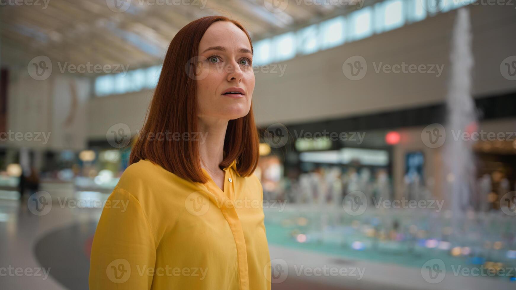Amazed smiling happy Caucasian business woman girl female businesswoman client consumer customer tourist shopper admiring looking around admire shopping mall store indoors. Travelling weekend commerce photo