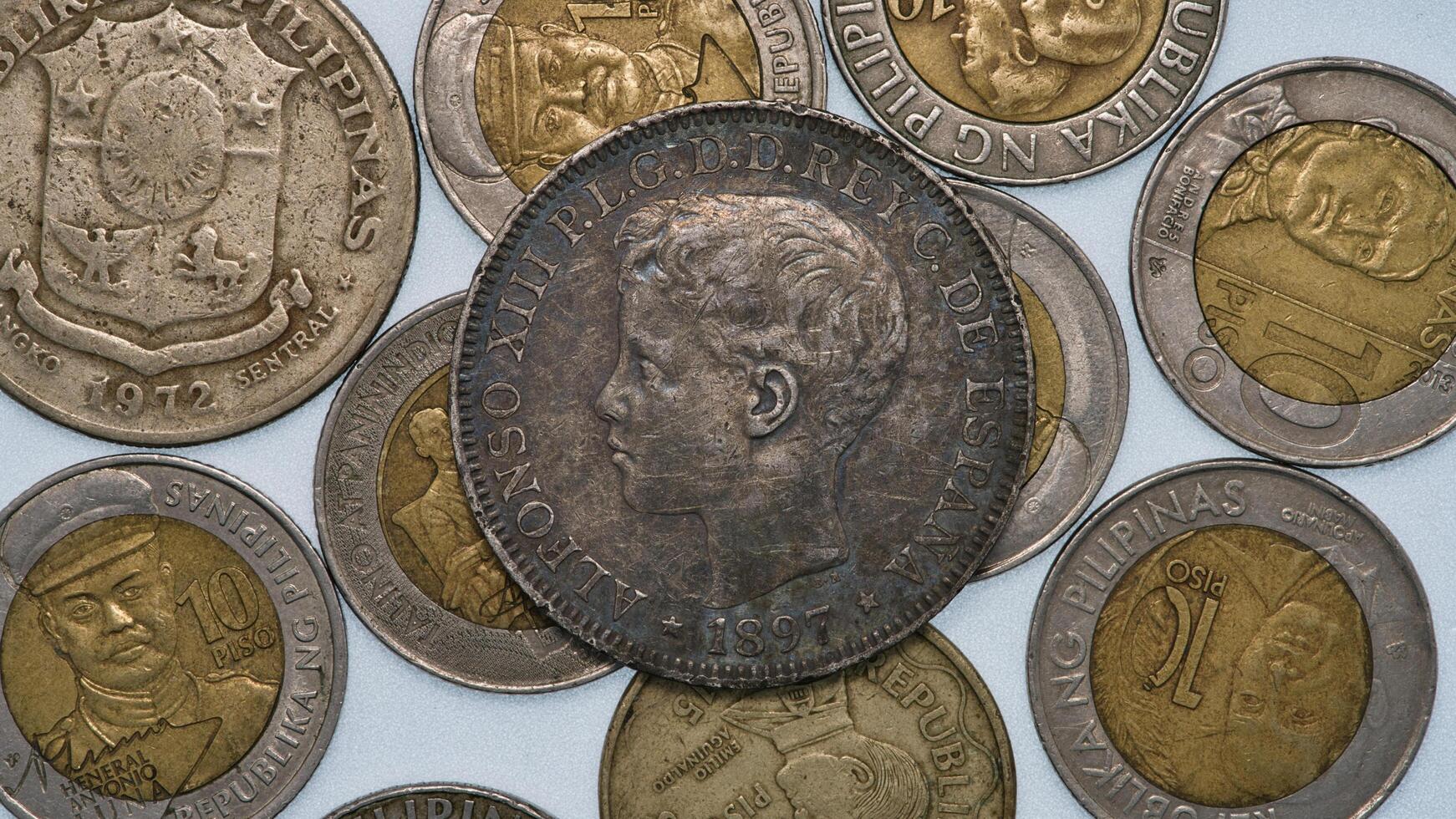 a group of coins with the image of a woman on them photo