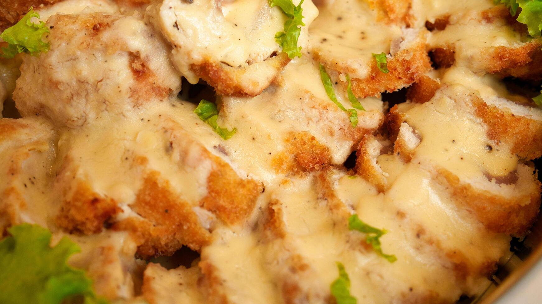 chicken cordon blue with cheese sauce photo