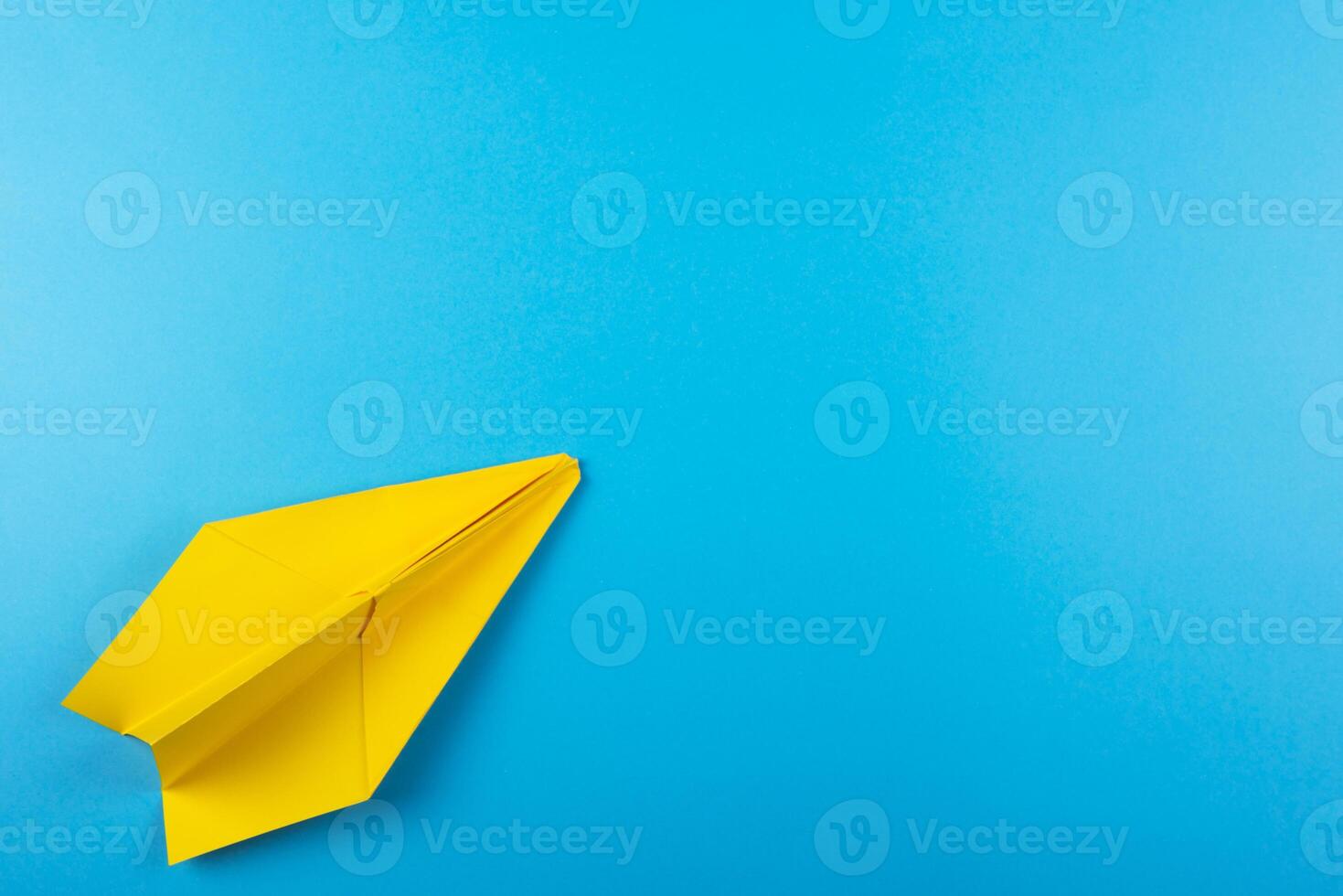 Flat lay of color paper plane photo