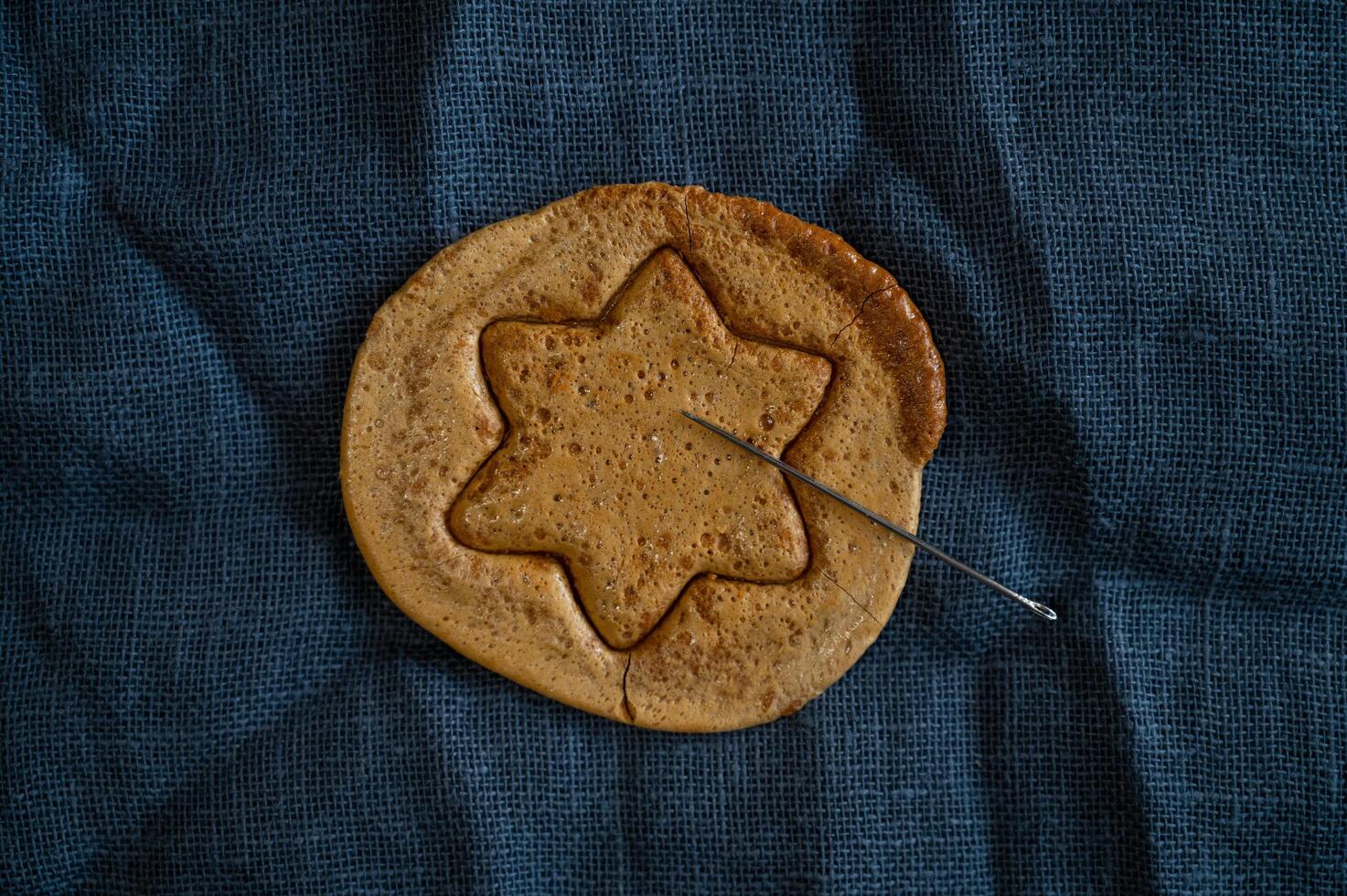 Brown sugar caramel candy cookies with a metal needle photo