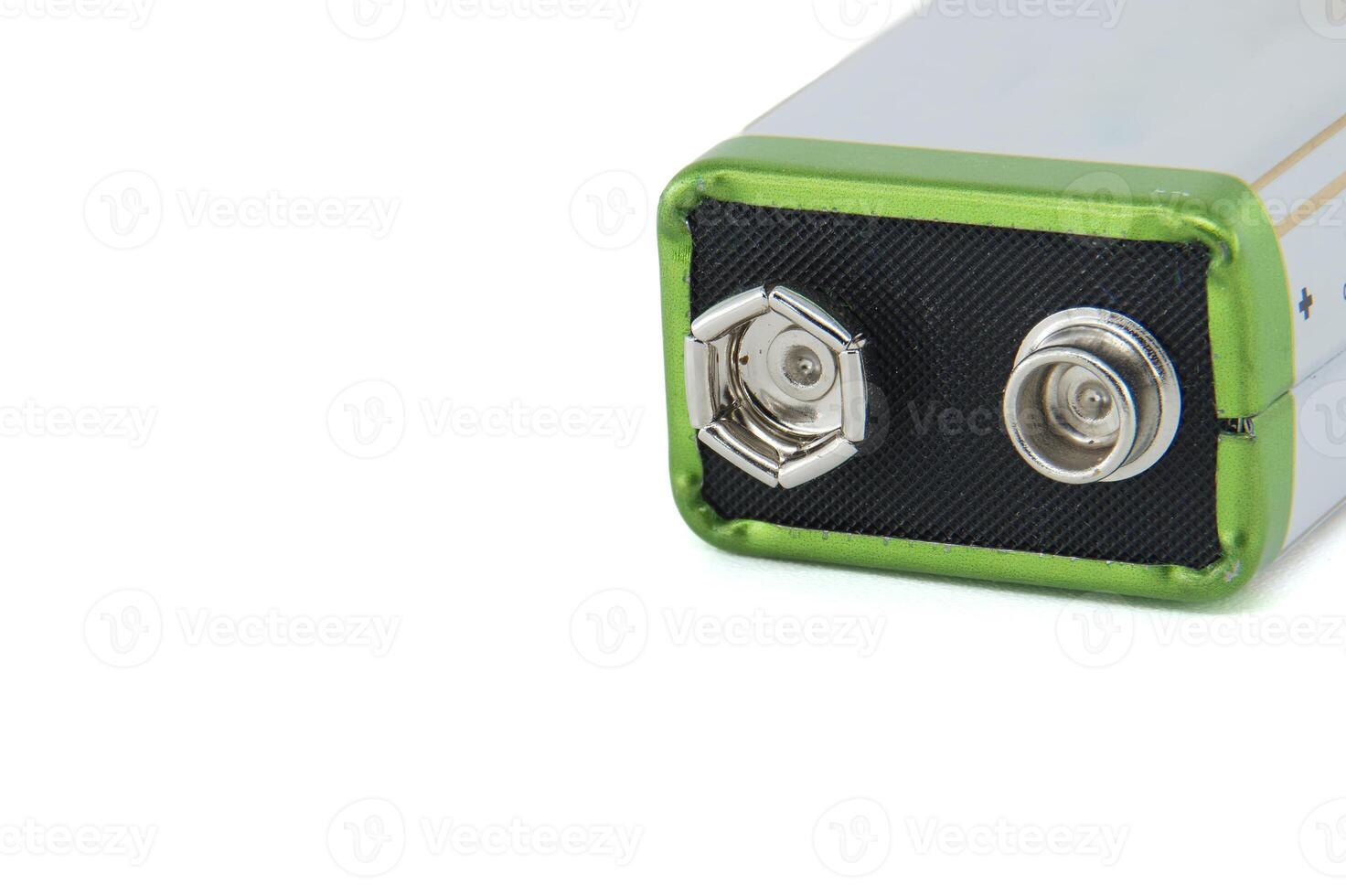 Close-up view of a 9-volt battery showing positive and negative terminals photo