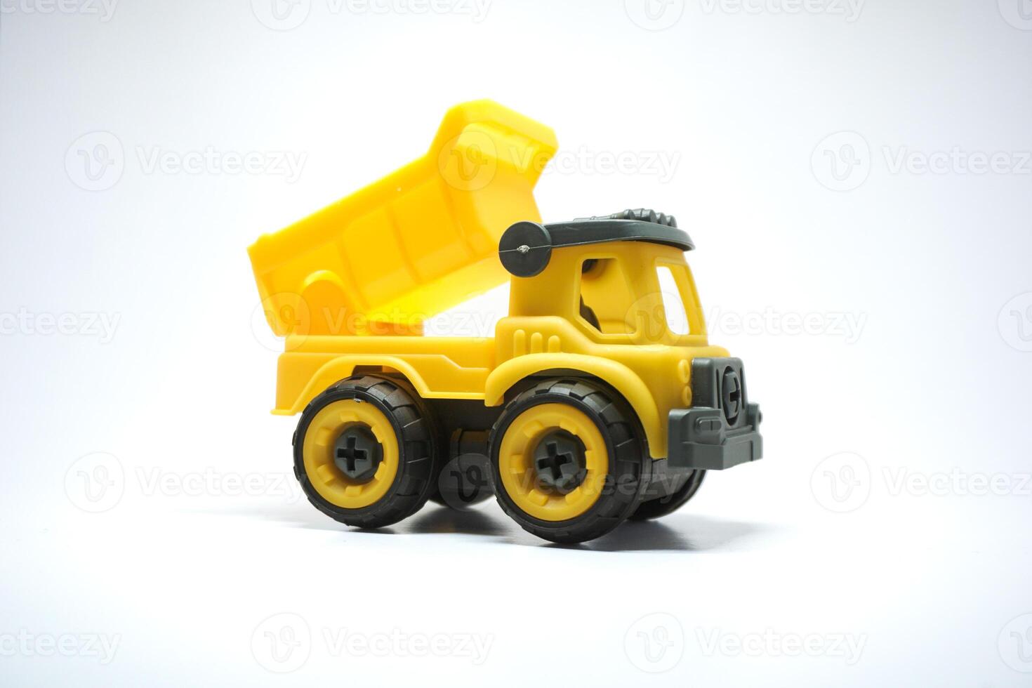 Yellow truck toy isolated on white background. photo