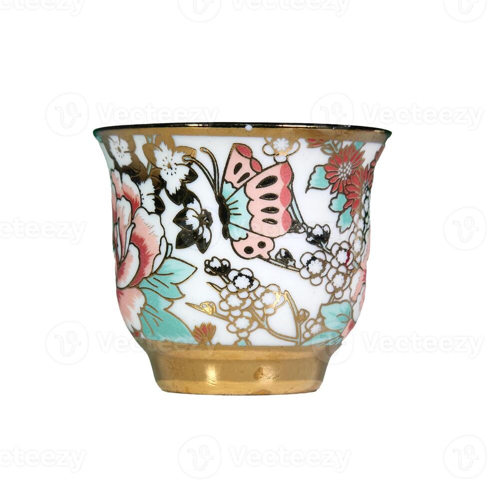 Elegant Porcelain Teacup with Floral and Butterfly Design, Gold Trim, Isolated on White Background photo