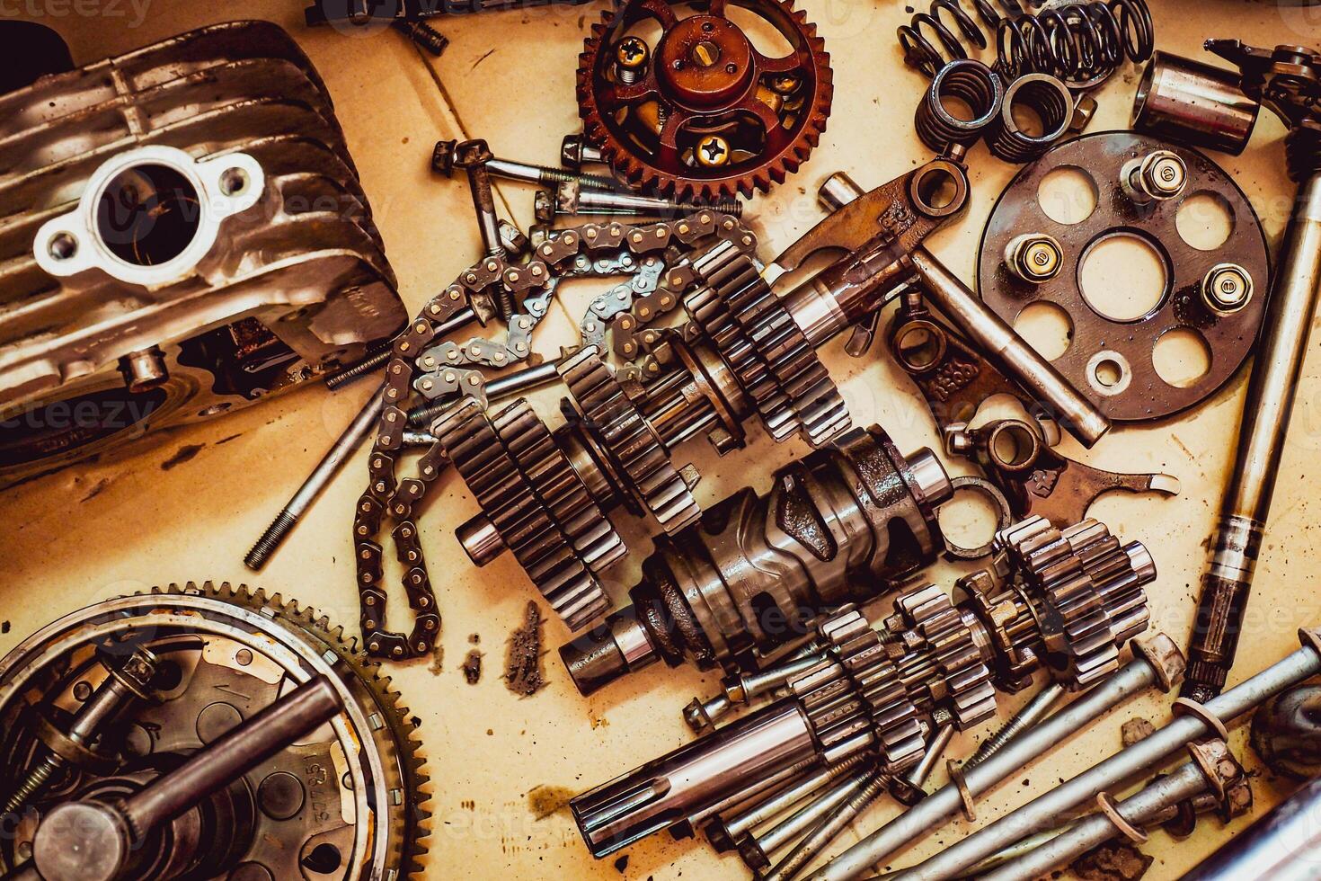 Assorted Mechanical Parts and Gears on a Workbench - Industrial and Engineering Components photo