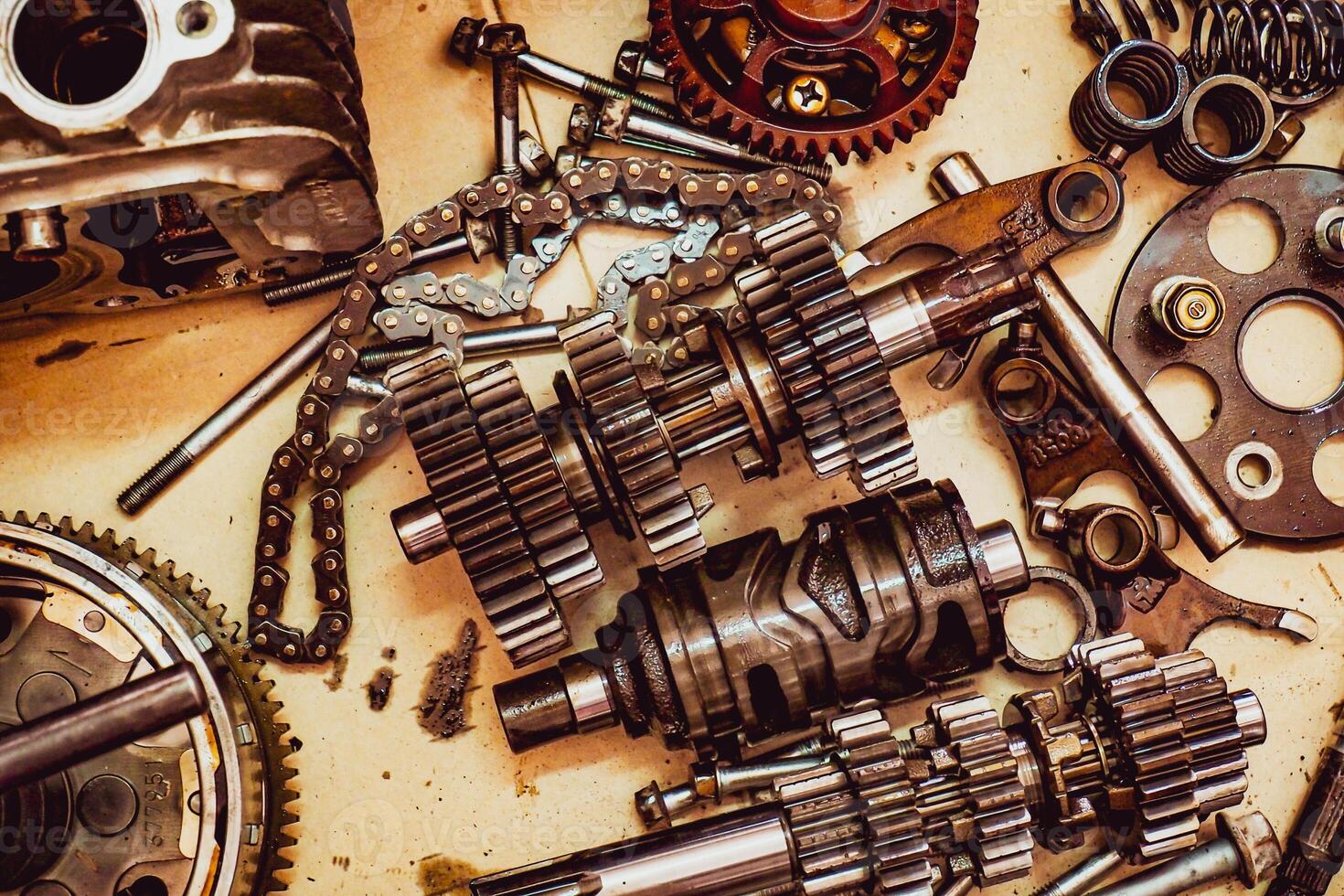 Close-Up of Mechanical Gears and Parts in a Workshop Setting with Vintage Tones photo