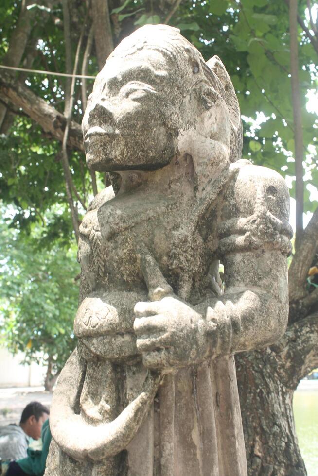 Indonesian stone statues exposed to hot sunlight photo