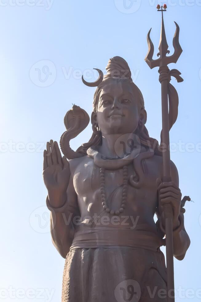 Big statue of Lord Shiv near Delhi International airport, Delhi, India, Lord Shiv big statue touching sky at main highway Mahipalpur, Delhi photo