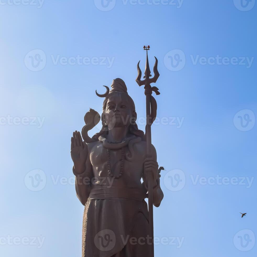 Big statue of Lord Shiv near Delhi International airport, Delhi, India, Lord Shiv big statue touching sky at main highway Mahipalpur, Delhi photo