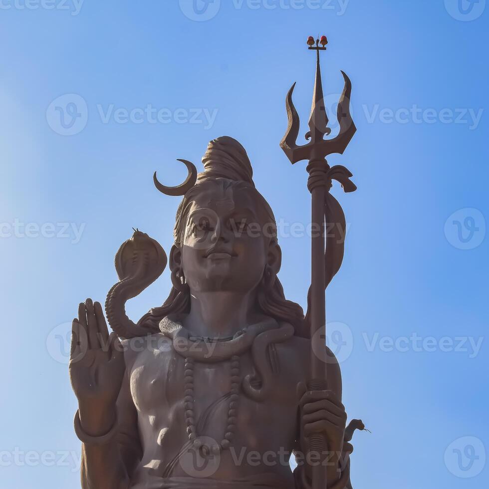 Big statue of Lord Shiv near Delhi International airport, Delhi, India, Lord Shiv big statue touching sky at main highway Mahipalpur, Delhi photo