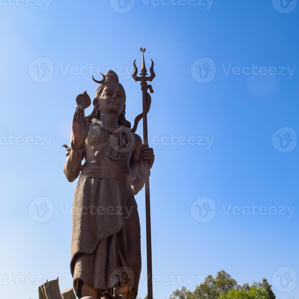 Big statue of Lord Shiv near Delhi International airport, Delhi, India, Lord Shiv big statue touching sky at main highway Mahipalpur, Delhi photo