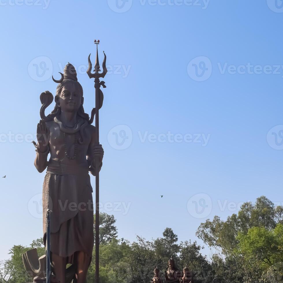 Big statue of Lord Shiv near Delhi International airport, Delhi, India, Lord Shiv big statue touching sky at main highway Mahipalpur, Delhi photo