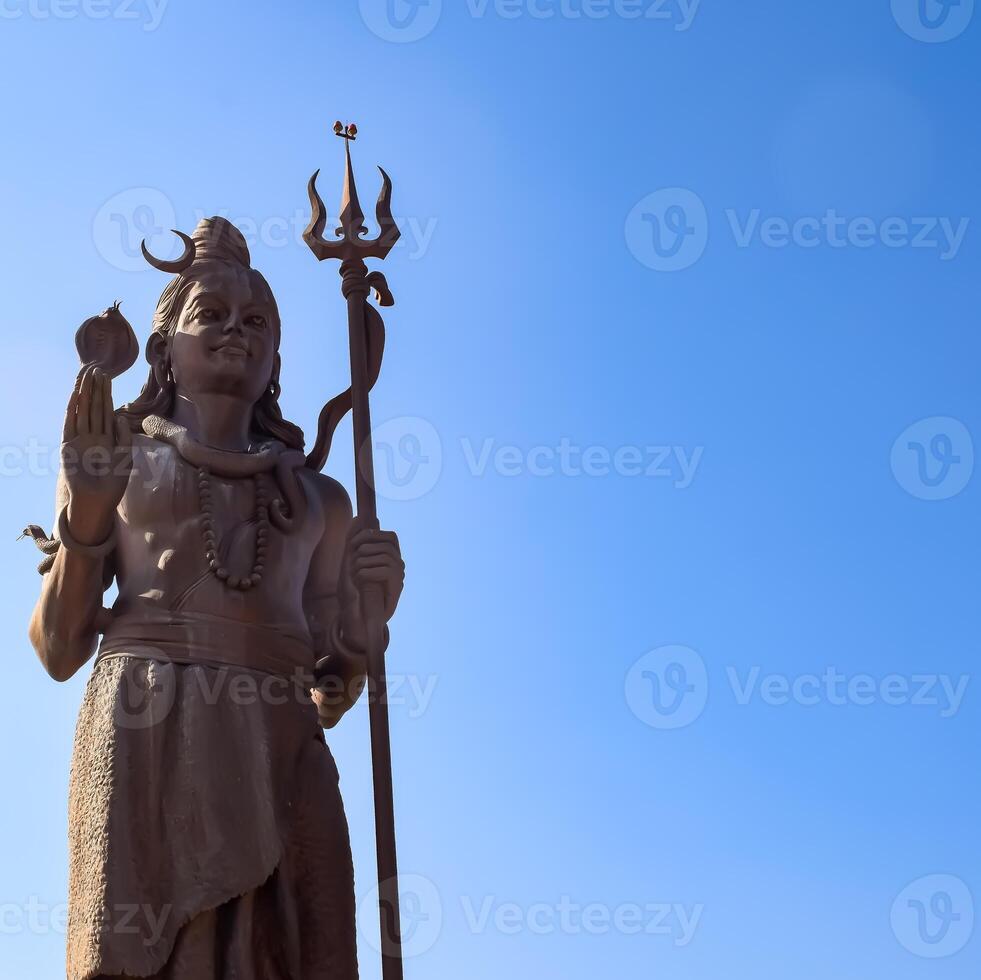 Big statue of Lord Shiv near Delhi International airport, Delhi, India, Lord Shiv big statue touching sky at main highway Mahipalpur, Delhi photo