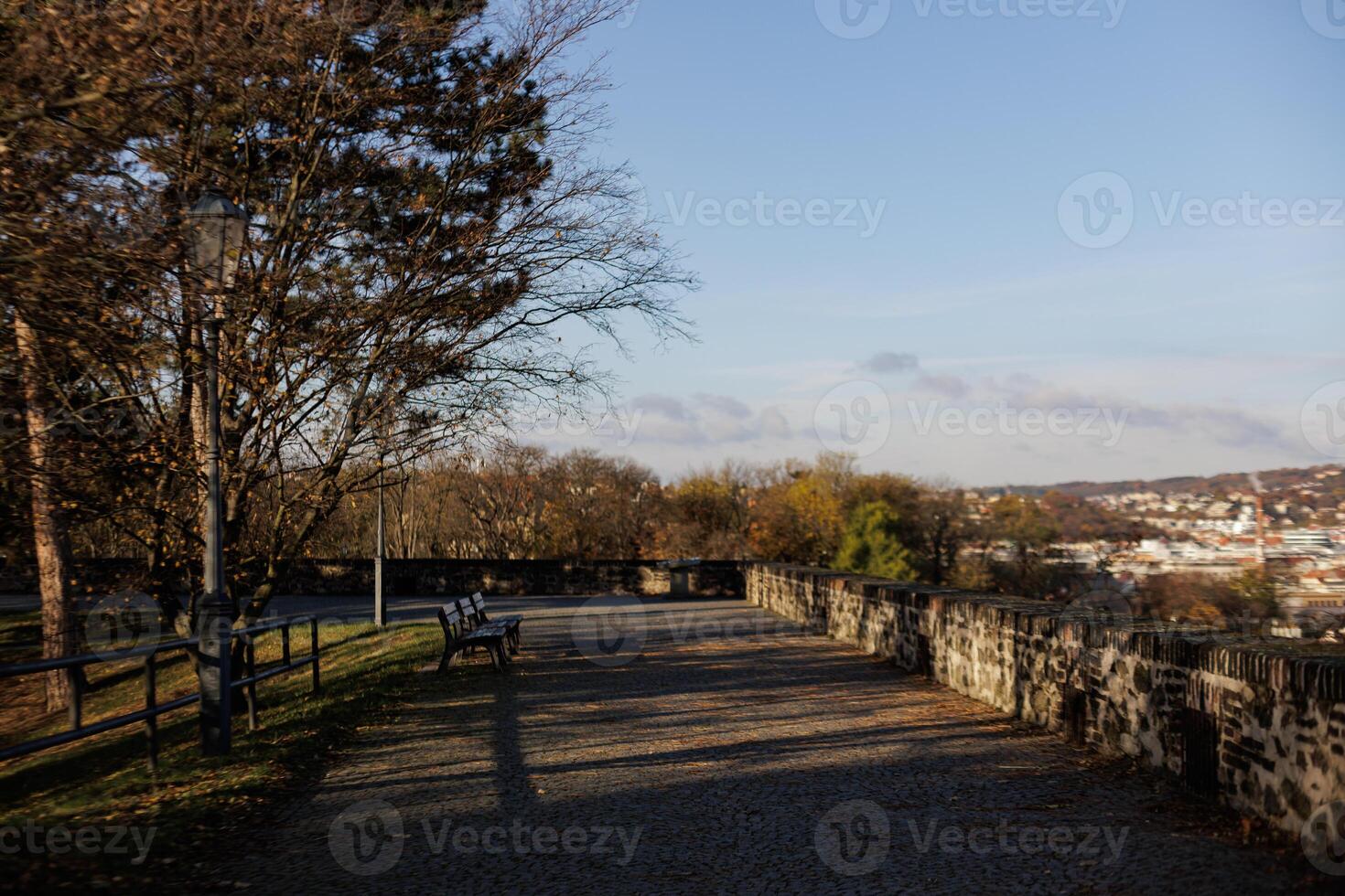 Walkway with benches and a view of the town in Vysehrad in Prague photo