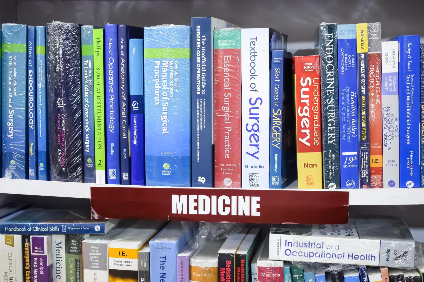 New Delhi, India, July 17 2024 - Variety of Books on shelf inside a book-stall at Delhi International Book Fair, Selection of books on display in Annual Book Fair at Bharat Mandapam complex photo