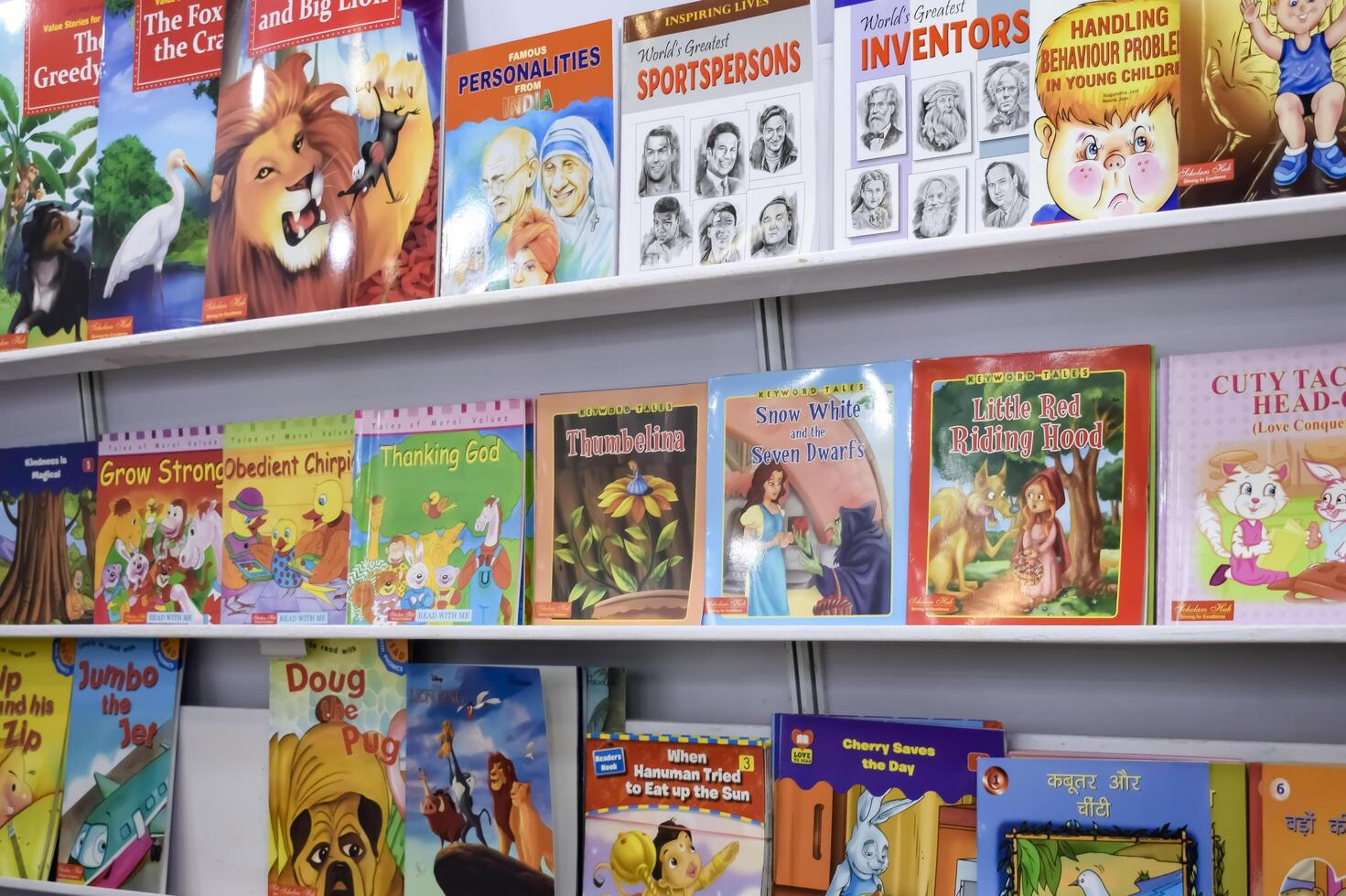 New Delhi, India, July 17 2024 - Variety of Books on shelf inside a book-stall at Delhi International Book Fair, Selection of books on display in Annual Book Fair at Bharat Mandapam complex photo