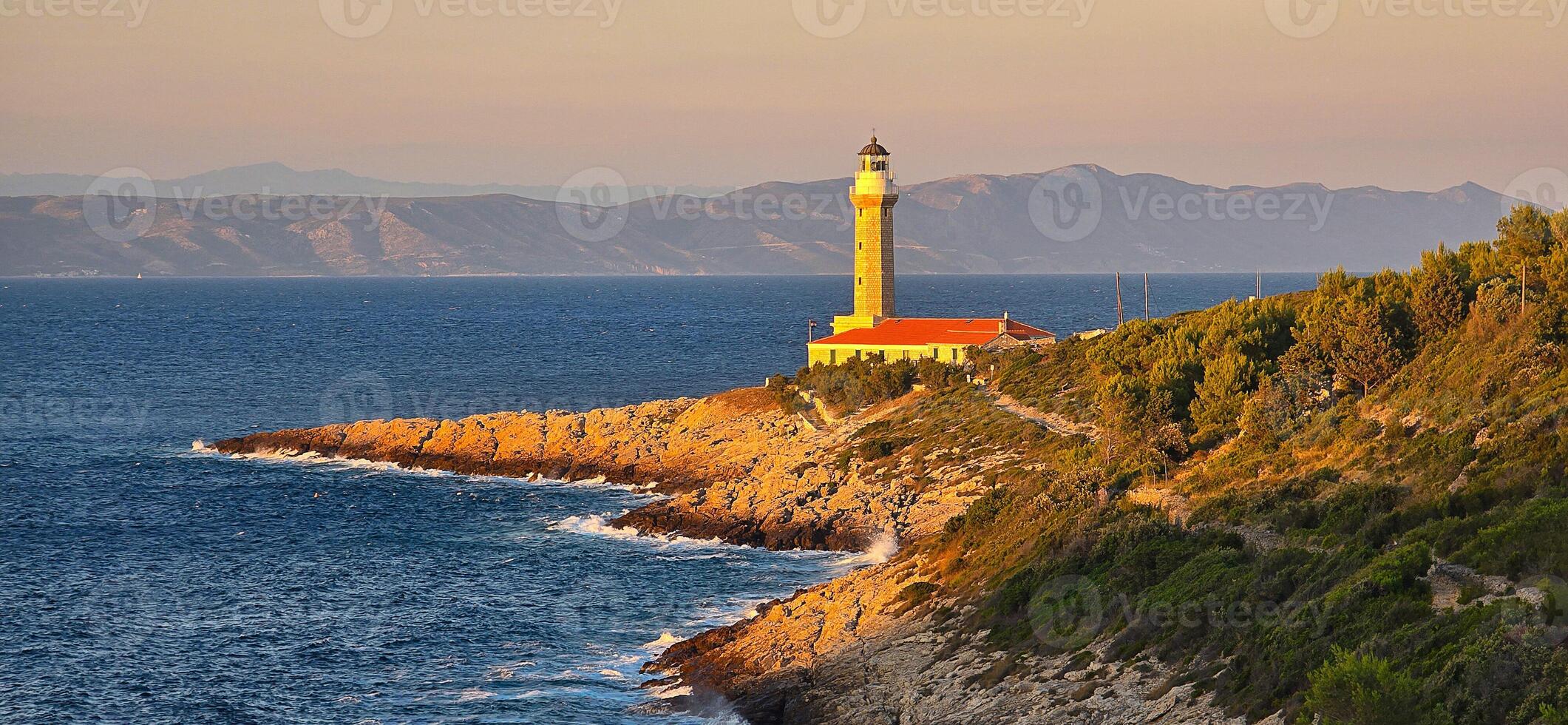 Lighthouse Stoncica at sunset light on island Vis, Croatia. photo