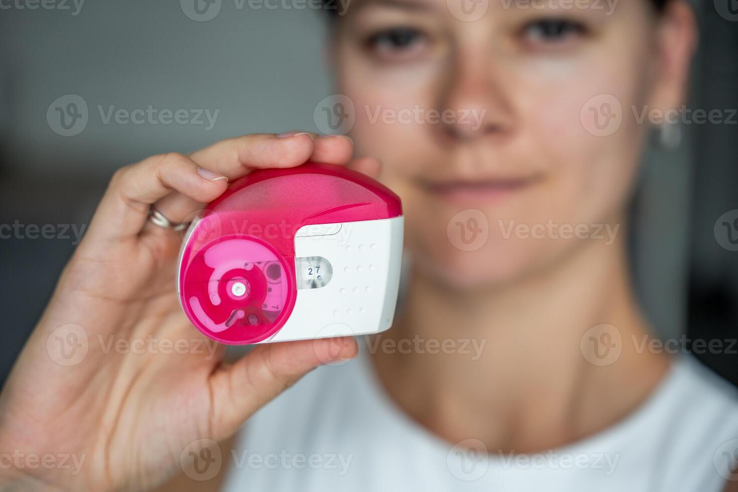 Close up of woman holding medicine dry powder inhaler for treatment asthma or COPD diseases. Pharmaceutical product is used to treat lung inflammation and prevent asthma attack. High quality photo