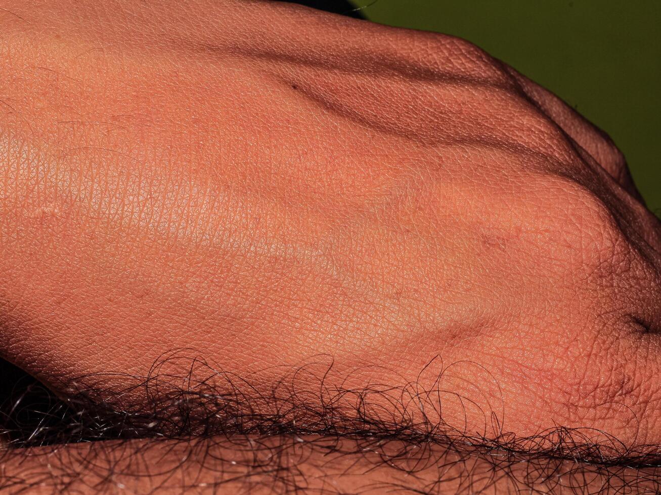 Male feet with clean white nails with brown skin color photo
