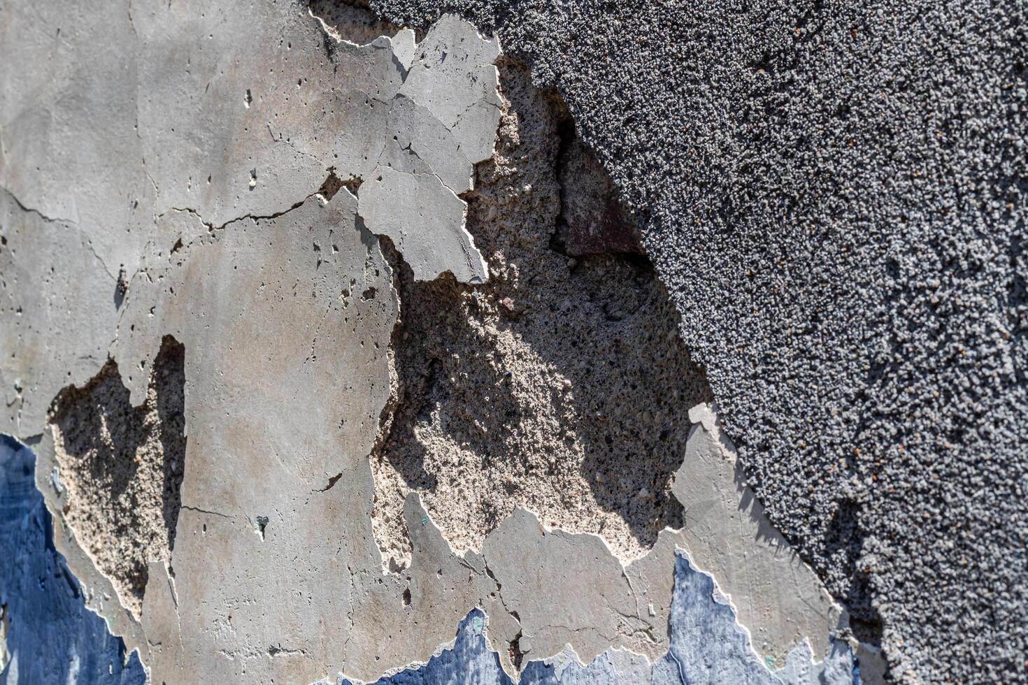 Background texture of a peeling wall due to weathering photo