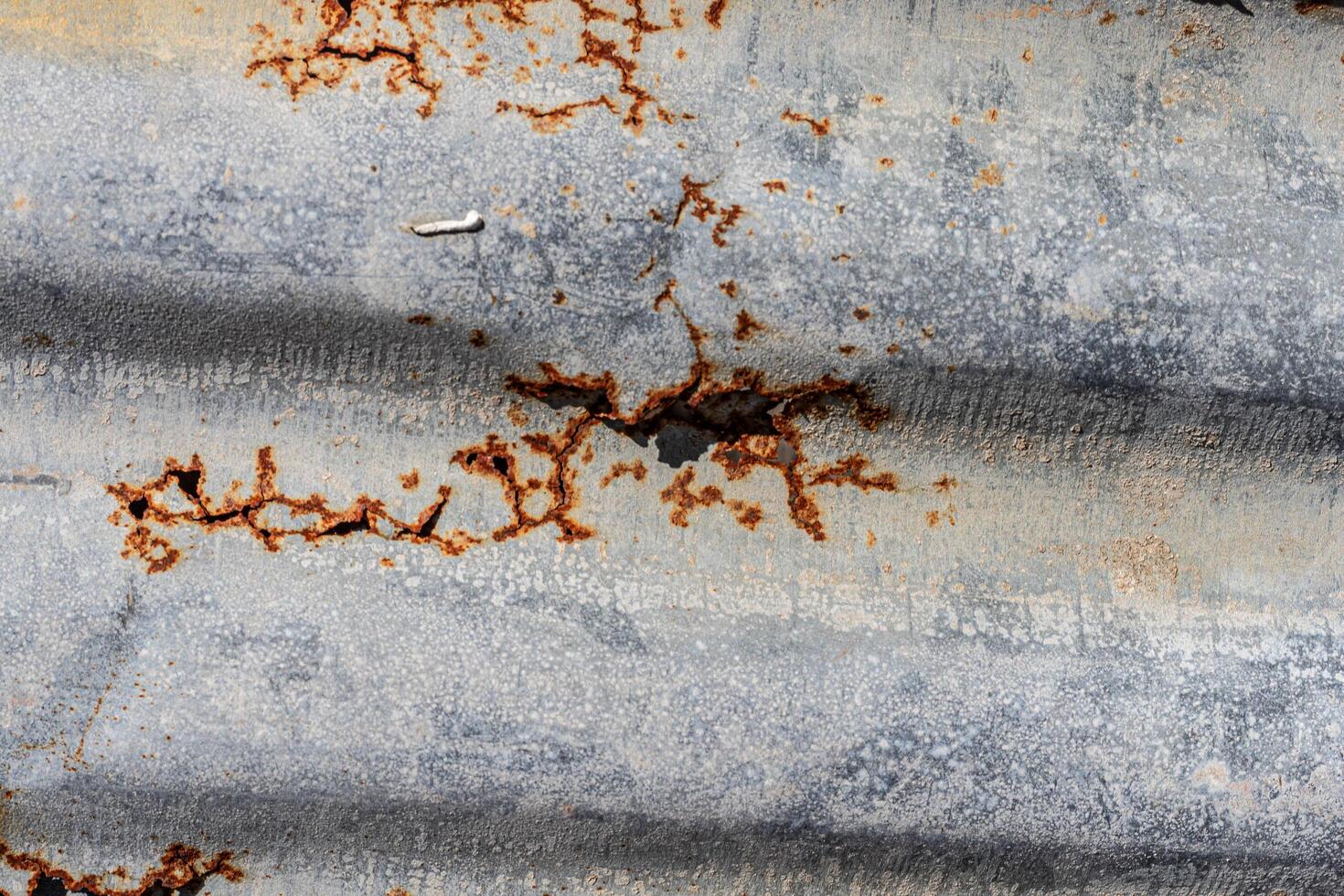 The texture of a rusty zinc wall weathered by the weather photo