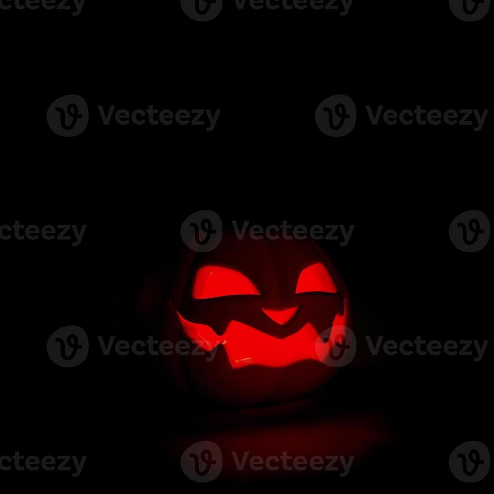 Halloween pumpkin smiles and glowing at night on black background. Scary Jack o lantern,3D rendering photo