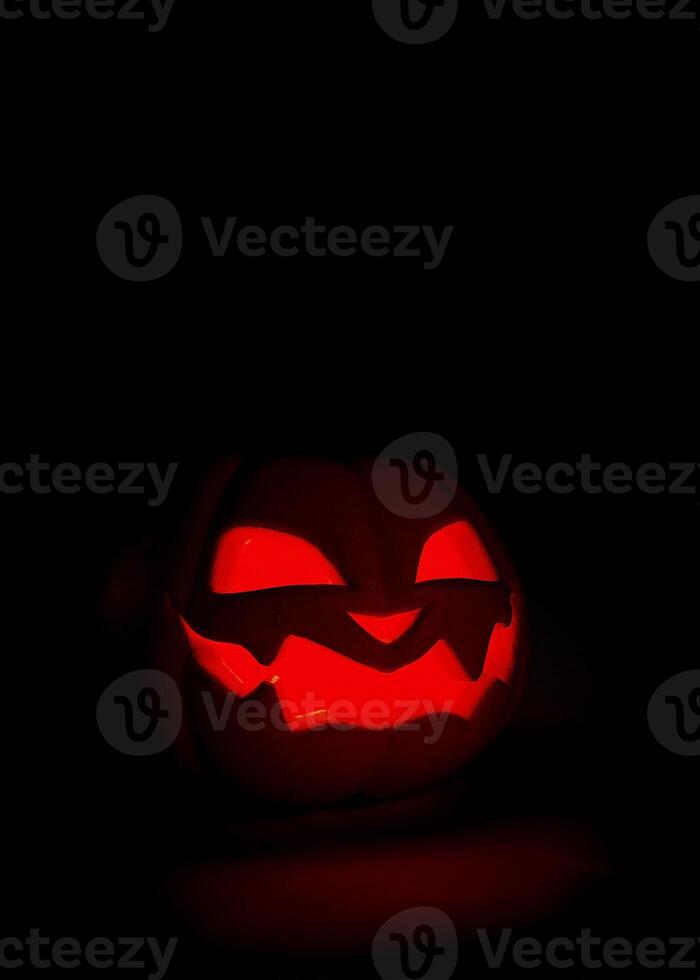 Halloween pumpkin glowing on black background. Scary Jack o lantern Halloween background. 3D rendering photo