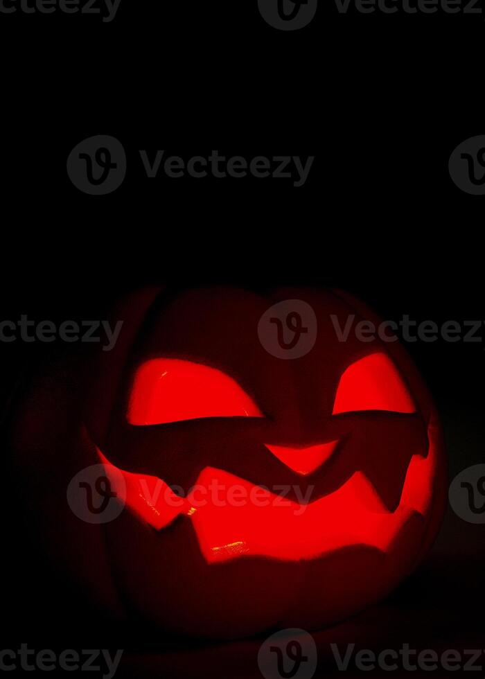Halloween pumpkin glowing on black background. Scary Jack o lantern Halloween background. 3D rendering photo