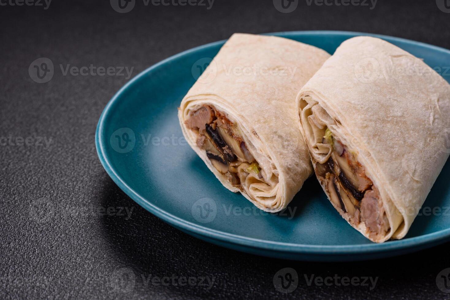 Delicious traditional shawarma or doner kebab with beef, mushrooms photo