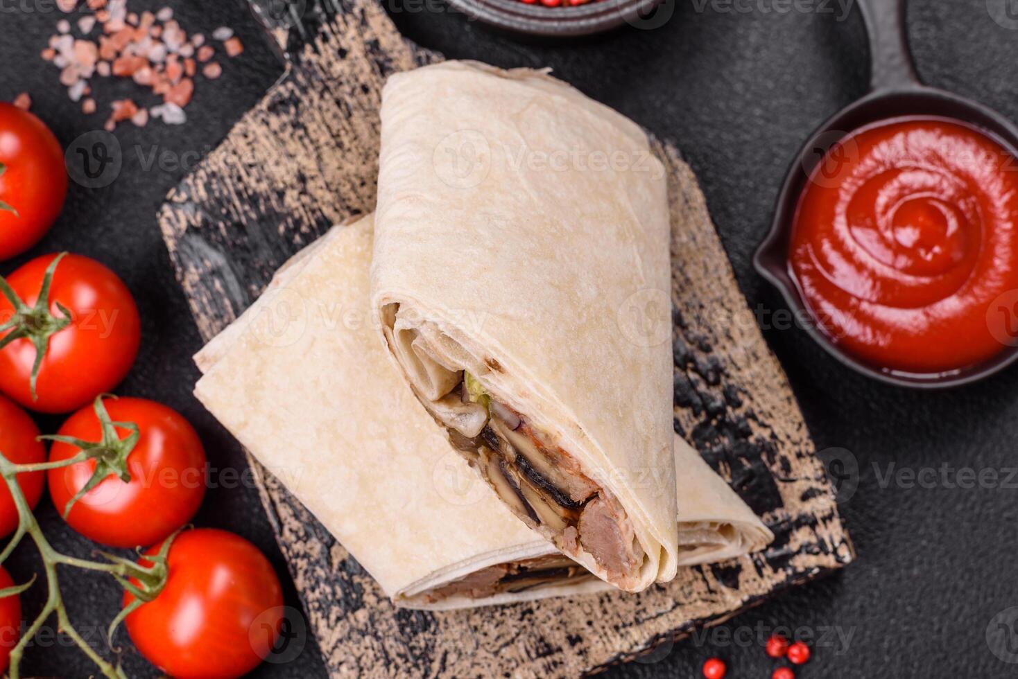 Delicious traditional shawarma or doner kebab with beef, mushrooms photo