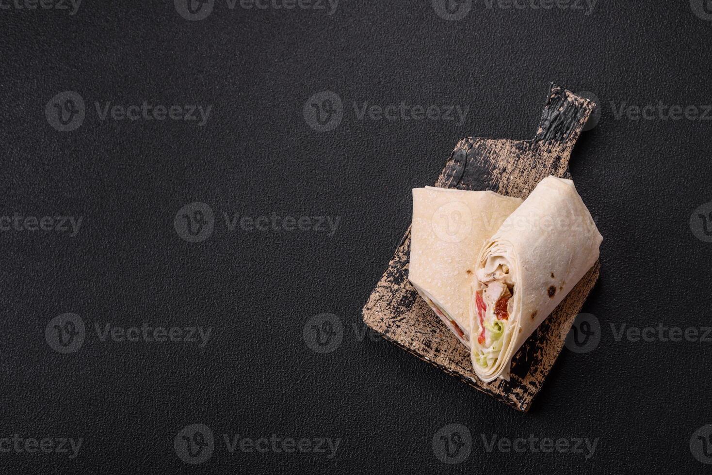 Delicious traditional shawarma or doner kebab with chicken photo